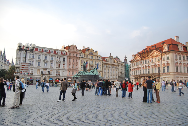 17 - The historic Old Town Square in Prague, Czech Republic, featuring the Jan Hus Memorial surrounded by people and classic architecture